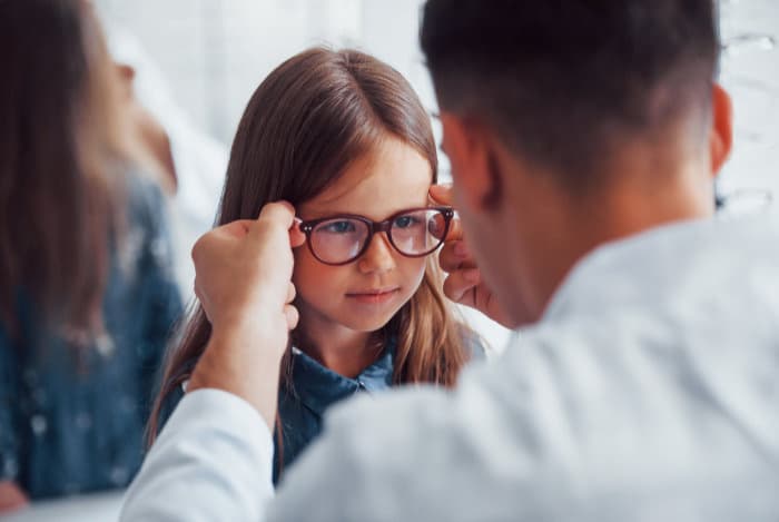 A child having a gentle pediatric eye exam at Senoia Eyecare